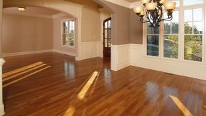 Image of empty room with wooden flooring.