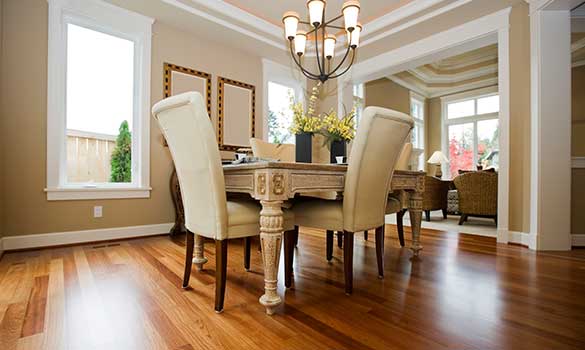 a hardwood floor in a dining room with modern furnishings