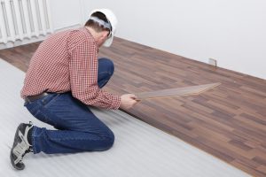 A flooring contractor installing a new floor